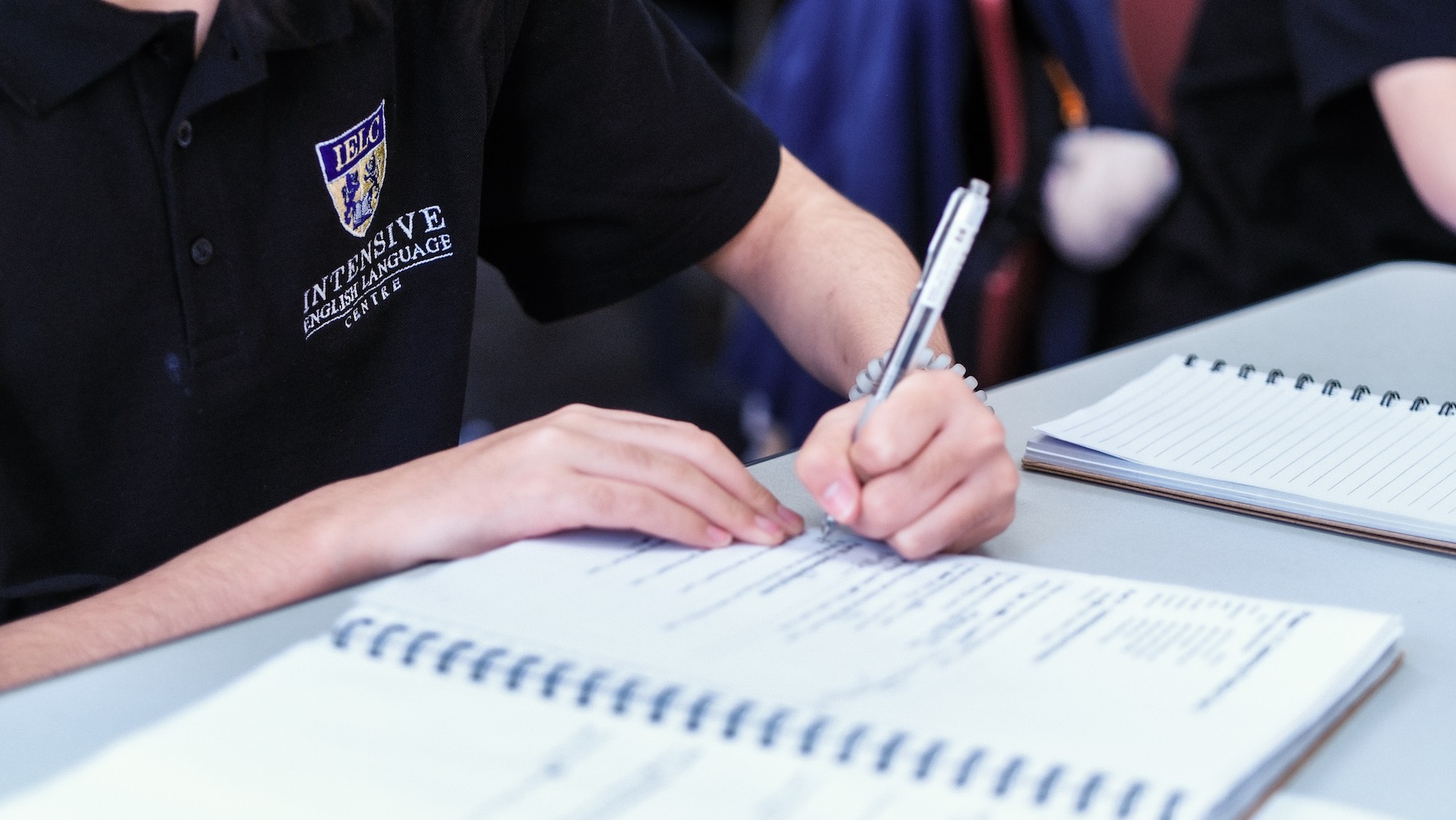 A student making notes during class